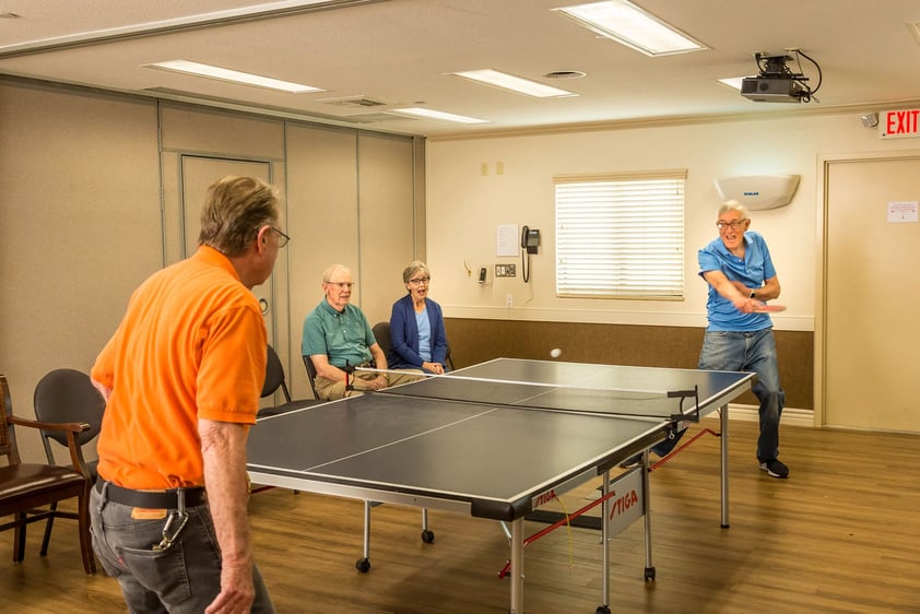 Two man playing ping pong