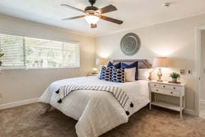 Bedroom with blue and white pillows