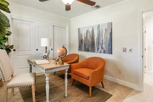 Office set up with two orange chairs