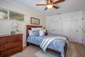 Bedroom with light blue and white bedspread