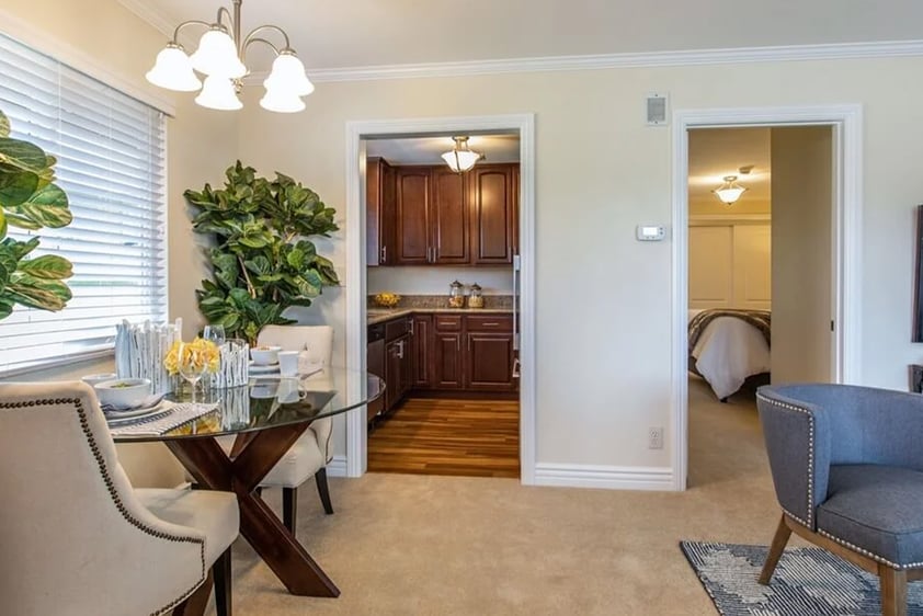 Dinette set with view through door to galley kitchen