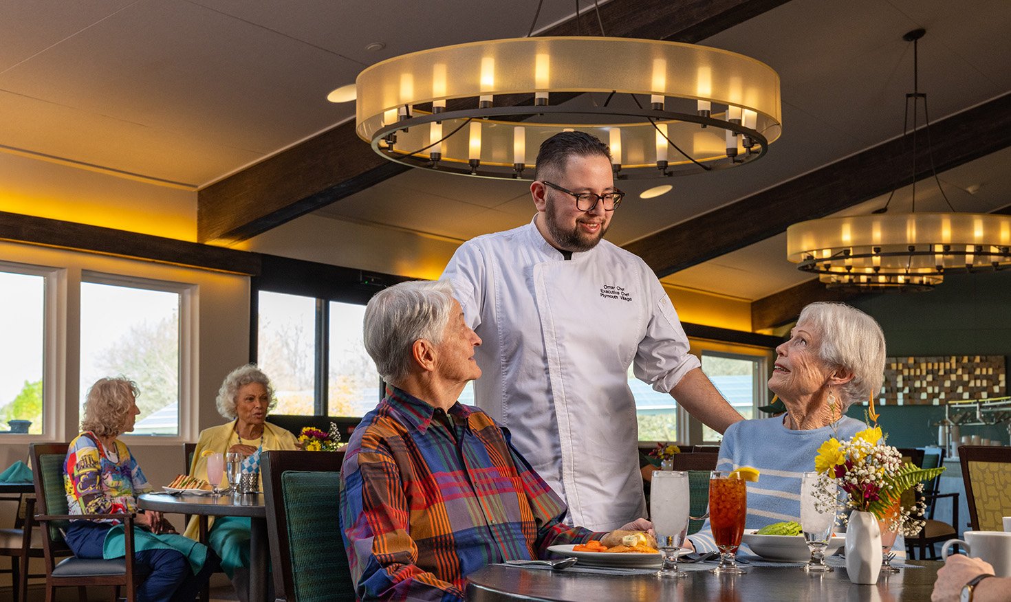 People dining with chef