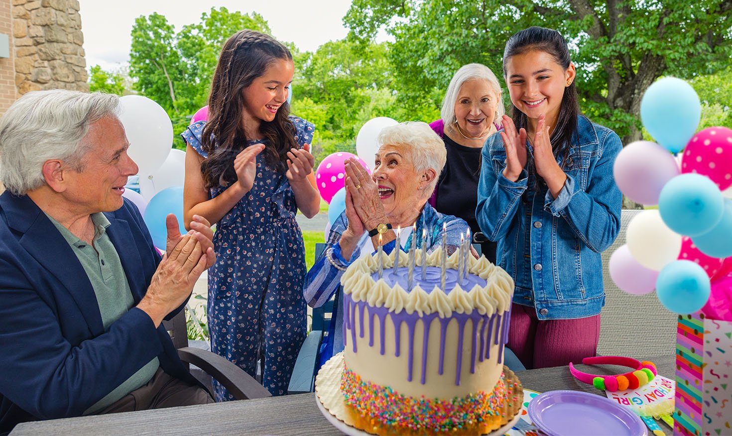 family celebrating their grandmother's birthday