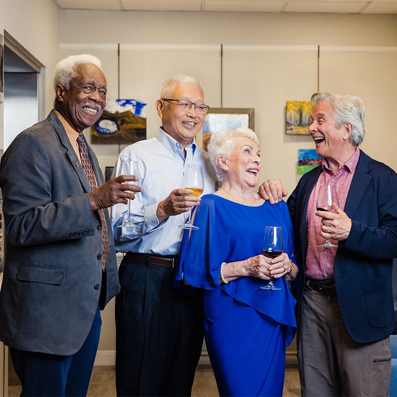 seniors enjoying an evening night out while drinking wine