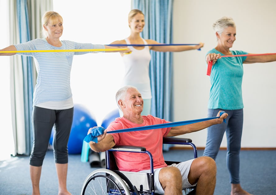 seniors in a fitness class doing resistance training