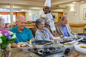 seniors enjoying lunch prepared by chef