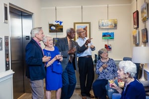 residents enjoying art at reception