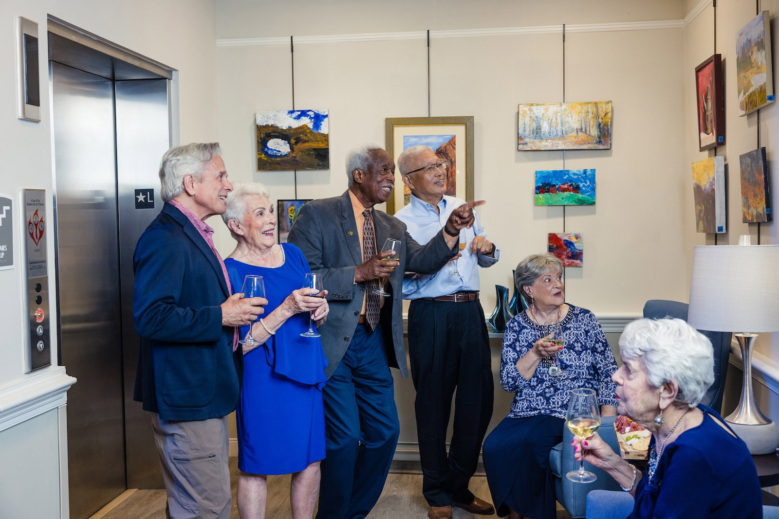 residents enjoying art at reception