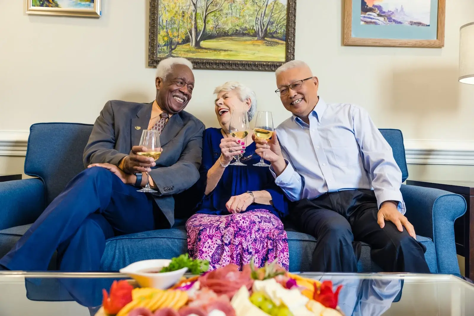 senior friends enjoying white wine together