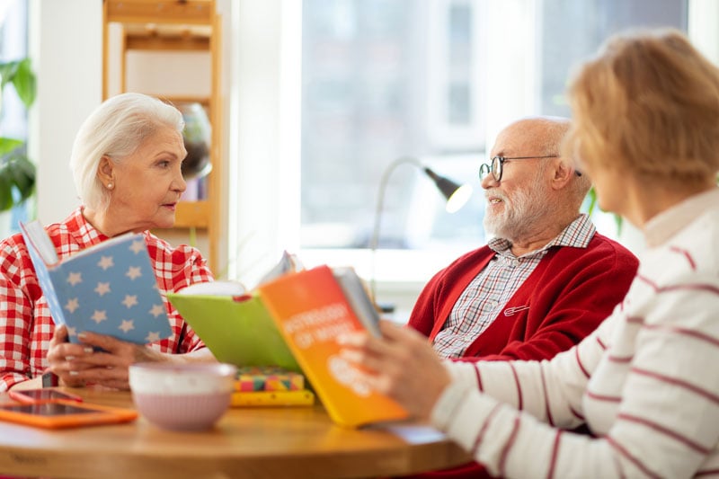 seniors engaging in a book club conversation